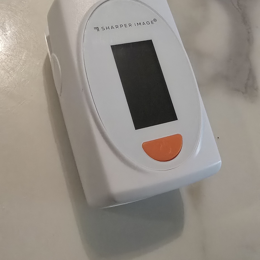 Sharper Image White and Orange Device